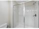 Modern bathroom featuring a glass shower door and tiled shower stall at 1432 Rolling Fairway Dr, Davenport, FL 33896