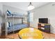 Fun bedroom with a bunk bed, colorful drawers, and TV at 1432 Rolling Fairway Dr, Davenport, FL 33896