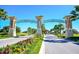 The ChampionsGate community entrance boasts manicured landscaping and a welcoming gate, enhancing the neighborhood's appeal at 1432 Rolling Fairway Dr, Davenport, FL 33896