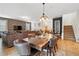 Open-concept dining area with tile flooring and rustic wood table is great for Gathering gatherings at 1432 Rolling Fairway Dr, Davenport, FL 33896