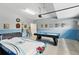 The garage includes game tables and door at 1432 Rolling Fairway Dr, Davenport, FL 33896