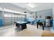 The garage includes game tables and garage door at 1432 Rolling Fairway Dr, Davenport, FL 33896