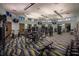 Bright fitness center featuring state-of-the-art equipment, TVs, and a dynamic patterned floor at 1432 Rolling Fairway Dr, Davenport, FL 33896