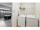 The laundry area includes a washer, dryer, and a laundry rack at 1432 Rolling Fairway Dr, Davenport, FL 33896