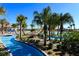 Enjoy the lazy river at the resort-style pool, surrounded by lush landscaping and scenic views at 1432 Rolling Fairway Dr, Davenport, FL 33896