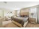 Comfortable main bedroom offers plush carpeting, neutral paint, and two bright windows at 1432 Rolling Fairway Dr, Davenport, FL 33896