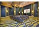 Community movie theater with comfortable seating, sleek design and large screen, perfect for residents' entertainment at 1432 Rolling Fairway Dr, Davenport, FL 33896