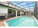 A stunning screened-in pool with ample space for lounge chairs and outdoor entertainment at 1432 Rolling Fairway Dr, Davenport, FL 33896