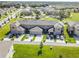 Aerial view of townhomes with attached garages and well-maintained lawns at 1459 Rylee Rock Way, Kissimmee, FL 34744