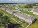 Expansive community with townhomes surrounded by lush green landscaping at 1459 Rylee Rock Way, Kissimmee, FL 34744