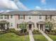 Charming townhome with manicured lawn and decorative shutters at 1459 Rylee Rock Way, Kissimmee, FL 34744