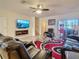 Cozy living room featuring tile floors, modern fireplace, and comfortable seating at 1459 Rylee Rock Way, Kissimmee, FL 34744