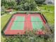 Aerial shot of two tennis courts with lush green surroundings, ideal for sports enthusiasts at 1459 Rylee Rock Way, Kissimmee, FL 34744