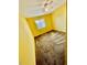 Bedroom with window, ceiling fan and a mustard yellow paint at 1916 Conway Rd # 11, Orlando, FL 32812