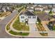Aerial view of a gray two-story home with solar panels in a residential neighborhood with manicured lawns at 204 Taft Dr, Davenport, FL 33837