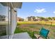 View of the backyard with partial patio, chair, and sport net at 204 Taft Dr, Davenport, FL 33837