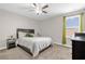 Comfortable bedroom with carpet, ceiling fan and natural light at 204 Taft Dr, Davenport, FL 33837