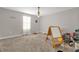 Spacious room with lots of natural light with a window, a whiteboard, and many toys and art supplies at 204 Taft Dr, Davenport, FL 33837