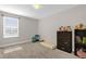 Bedroom with carpet flooring, window and dresser at 204 Taft Dr, Davenport, FL 33837