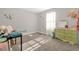 Playful ' bedroom with a green dresser, colorful decor, and ample space for toys and activities at 204 Taft Dr, Davenport, FL 33837