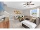Inviting living room featuring a plush sectional, neutral walls, and decorative accents for a cozy atmosphere at 204 Taft Dr, Davenport, FL 33837