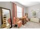 Relaxing living room with comfortable seating, soft pink accents, and a decorative lighthouse, perfect for lounging at 204 Taft Dr, Davenport, FL 33837