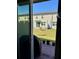 View of the backyard with a grill, patio, and grassy lawn through sliding glass doors at 2040 Milkweed St, Ocoee, FL 34761