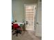 Bathroom view from a bedroom, featuring neutral decor, carpeted floors, and tile flooring at 2040 Milkweed St, Ocoee, FL 34761