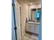 Modern bathroom features double sinks, granite countertops, and updated fixtures at 2040 Milkweed St, Ocoee, FL 34761