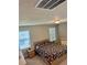Bedroom with two windows, neutral walls, and carpeted floors at 2040 Milkweed St, Ocoee, FL 34761