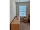 A cozy bedroom nook showcases a dresser and a window that provides natural light to the bedroom at 2040 Milkweed St, Ocoee, FL 34761