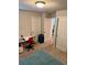 Cozy bedroom featuring neutral walls, carpeted floors, and an open doorway at 2040 Milkweed St, Ocoee, FL 34761