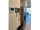 Inviting entryway features a modern thermostat, stainless steel refrigerator, and decorative 'Home Sweet Home' key holder at 2040 Milkweed St, Ocoee, FL 34761