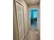 Hallway leads to bright room with a desk and windows allowing for natural light at 2040 Milkweed St, Ocoee, FL 34761