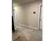 Upstairs hallway with neutral carpeting and paint, connecting various rooms in the home at 2040 Milkweed St, Ocoee, FL 34761