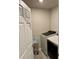 Laundry room with modern washer and dryer units and neutral walls at 2040 Milkweed St, Ocoee, FL 34761