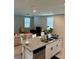 Modern island kitchen seamlessly flows into the living area, perfect for entertaining guests at 2040 Milkweed St, Ocoee, FL 34761