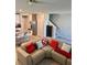 Bright living area featuring an open floor plan connecting the kitchen with stairs to a upper level at 2040 Milkweed St, Ocoee, FL 34761