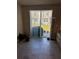 Living room features tile floors, a sliding glass door, and neutral paint at 2040 Milkweed St, Ocoee, FL 34761