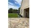 Spacious backyard features a well maintained lawn, paved patio, and landscaping at 205 Lexingdale Dr, Orlando, FL 32828