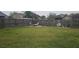 Spacious backyard features a firepit and soccer net, ideal for entertaining and recreation at 205 Lexingdale Dr, Orlando, FL 32828