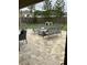 The covered patio area features wicker furniture that provides a cozy outdoor seating space at 205 Lexingdale Dr, Orlando, FL 32828
