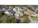 Aerial view of a single Gathering home with attached garage in a neighborhood with mature landscaping at 2102 Congress Ln, St Cloud, FL 34769