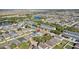 Aerial view of the property showing its location near a lake and other homes at 2102 Congress Ln, St Cloud, FL 34769
