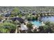 Community pool, playground and clubhouse, as seen from an aerial view at 2102 Congress Ln, St Cloud, FL 34769