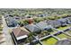 An aerial view of the home in relation to other houses and green spaces in the neighborhood at 2102 Congress Ln, St Cloud, FL 34769