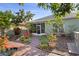 Backyard oasis with a screened porch, lush landscaping, and a tranquil atmosphere at 2102 Congress Ln, St Cloud, FL 34769