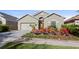 Inviting home with a well-manicured lawn and colorful flowerbeds enhancing the curb appeal at 2102 Congress Ln, St Cloud, FL 34769