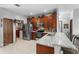 Functional kitchen featuring stainless appliances, a mosaic backsplash, and a counter-height breakfast bar at 2102 Congress Ln, St Cloud, FL 34769
