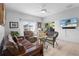 Relaxing living area with wicker seating, a ceiling fan, and a TV, perfect for lounging at 2102 Congress Ln, St Cloud, FL 34769